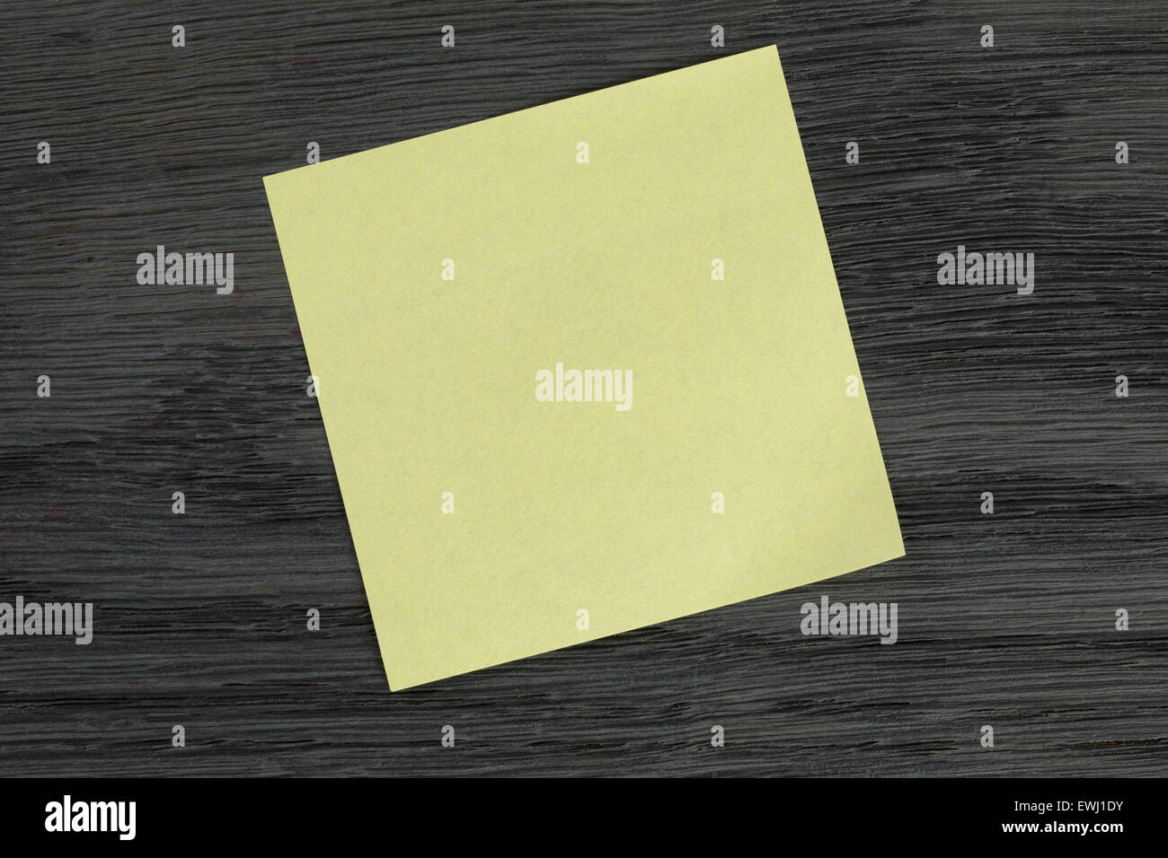 yellow sticky note on wooden table Stock Photo Alamy