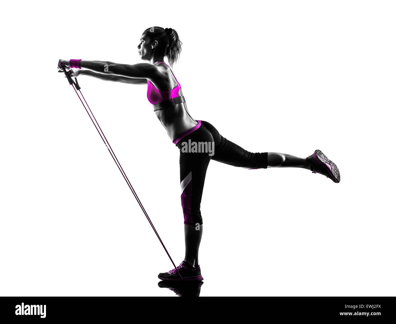 one caucasian woman exercising  fitness resistance bands in studio silhouette isolated on white background Stock Photo