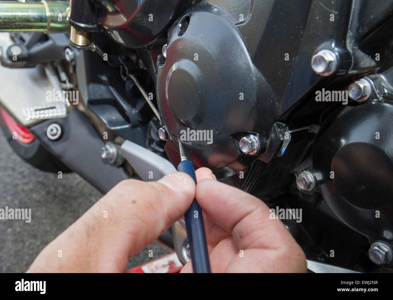 painting scratch on motorbike crank case Stock Photo Alamy