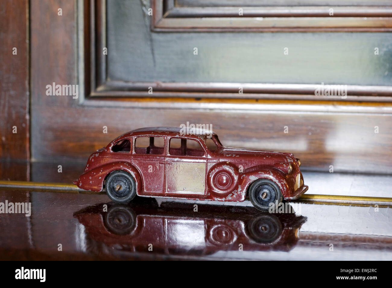 dinky Buick saloon, from 1940's on a shiny wood surface. Stock Photo