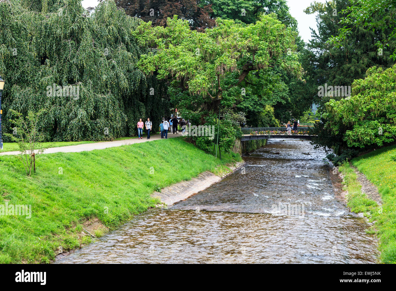 People walking along the river in Baden Baden, Germany. Stock Photo