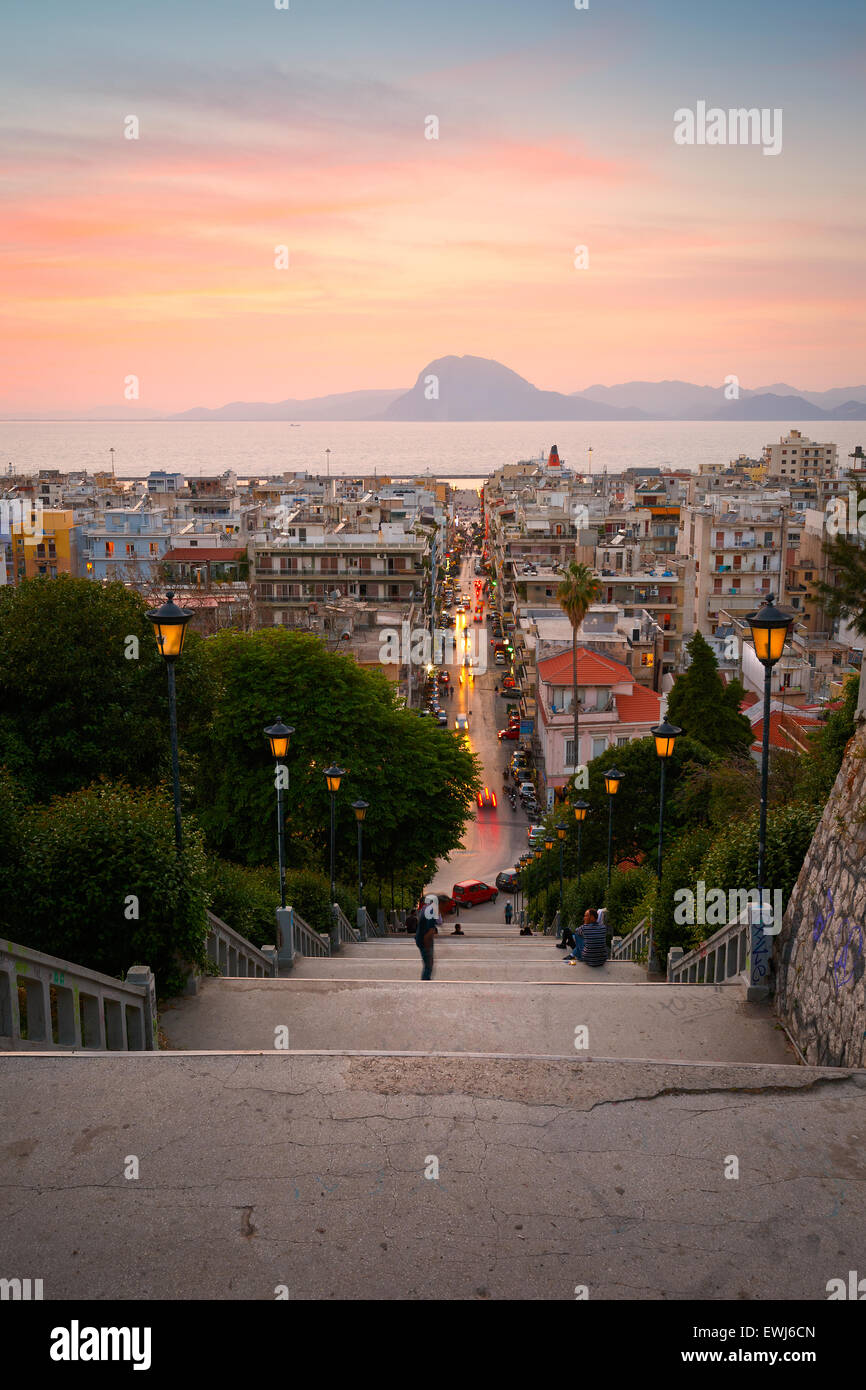 People enjoying the view of the city of Patras from the staircase leading from city centre to the top of the castle hill Stock Photo