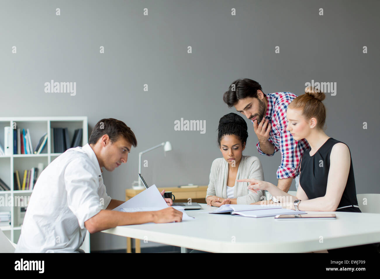 Young people in the office Stock Photo - Alamy