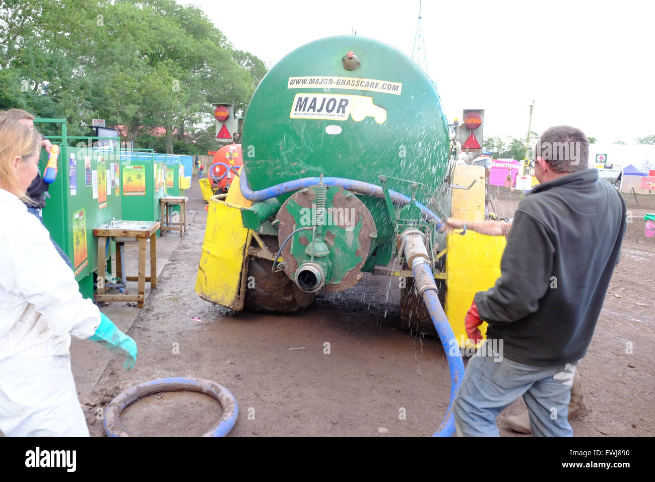 Glastonbury Festival, Somerset, UK. 27 June 2015.  Festival staff suffer what is technically known as 'blowback' while emptying  the notorious 'long drops' ready for another day. Credit:  Tom Corban/Alamy Live News Stock Photo