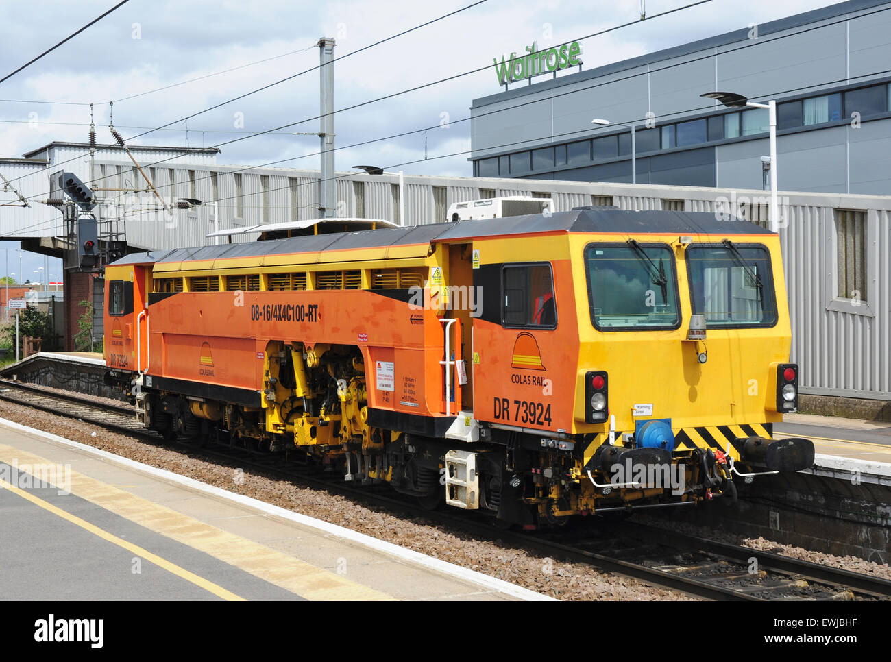 Colas Rail track ballast tamper machine No. DR 73924 at Peterborough station, Cambridgeshire, England, UK Stock Photo