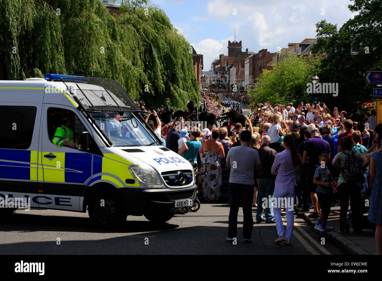 Guildford, Surrey, UK. 27th June, 2015.   Armed Forces Day parade in Guildford High Street. Police watch over visitors as Guildford High Street is closed off to allow local people and the wider communuty to watch the parade and thank everyone in the Armed Forces Credit:  Bruce McGowan/Alamy Live News Stock Photo