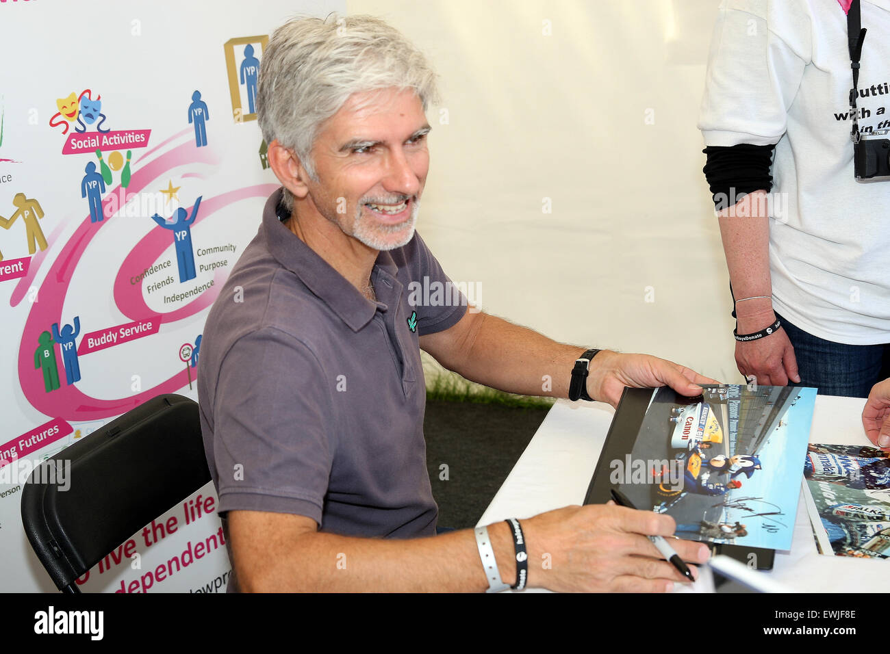 Goodwood, West Sussex, UK. 27th June, 2015. Damon Hill signs autographs at Goodwood Festival of Speed,  Goodwood, UK, 27th June 2015 Credit:  Rally-Pics.com/Alamy Live News Stock Photo