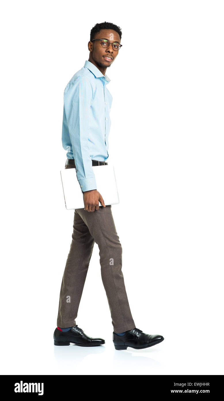 African american college student with laptop standing on white background Stock Photo