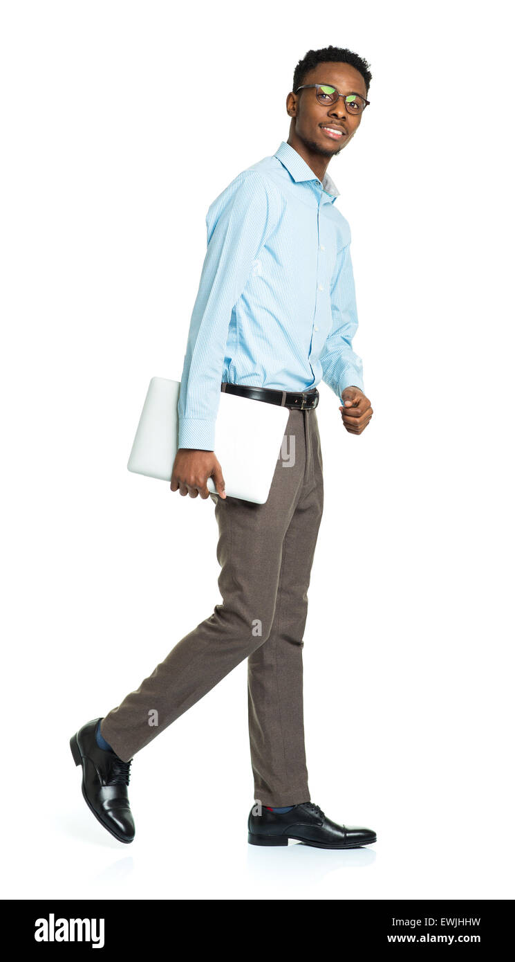 Happy african american college student with laptop standing on white background Stock Photo