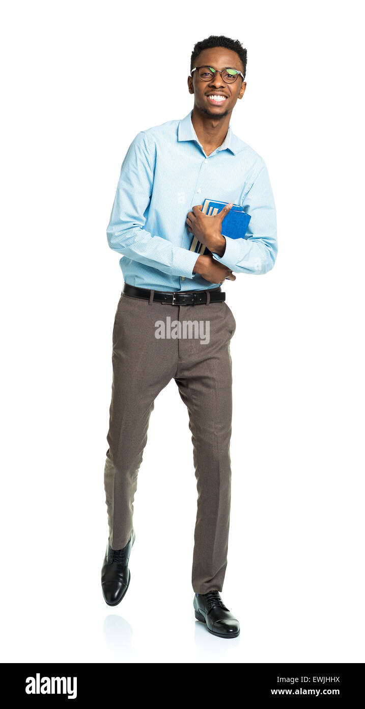 Happy african american college student with books in his hands standing on white background Stock Photo