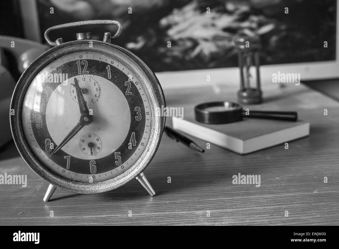 Alarm clock with black and white images Stock Photo - Alamy