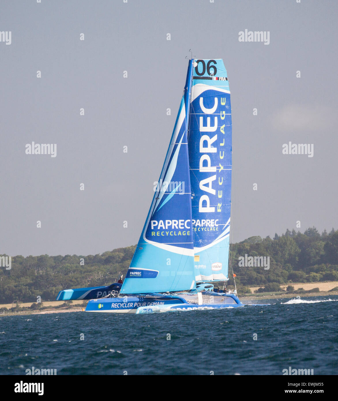 West Solent towards the Needles, UK. 27th June, 2015.  The MOD70 trimaran Concise 10 took line honours in the 2015 Round the Island Race, finishing at 1040, with an elapsed time of three hours, 30 minutes and 24 seconds. She is seen here heading through the west Solent towards the Needles shortly after the start of the race Credit:  Niall Ferguson/Alamy Live News Stock Photo