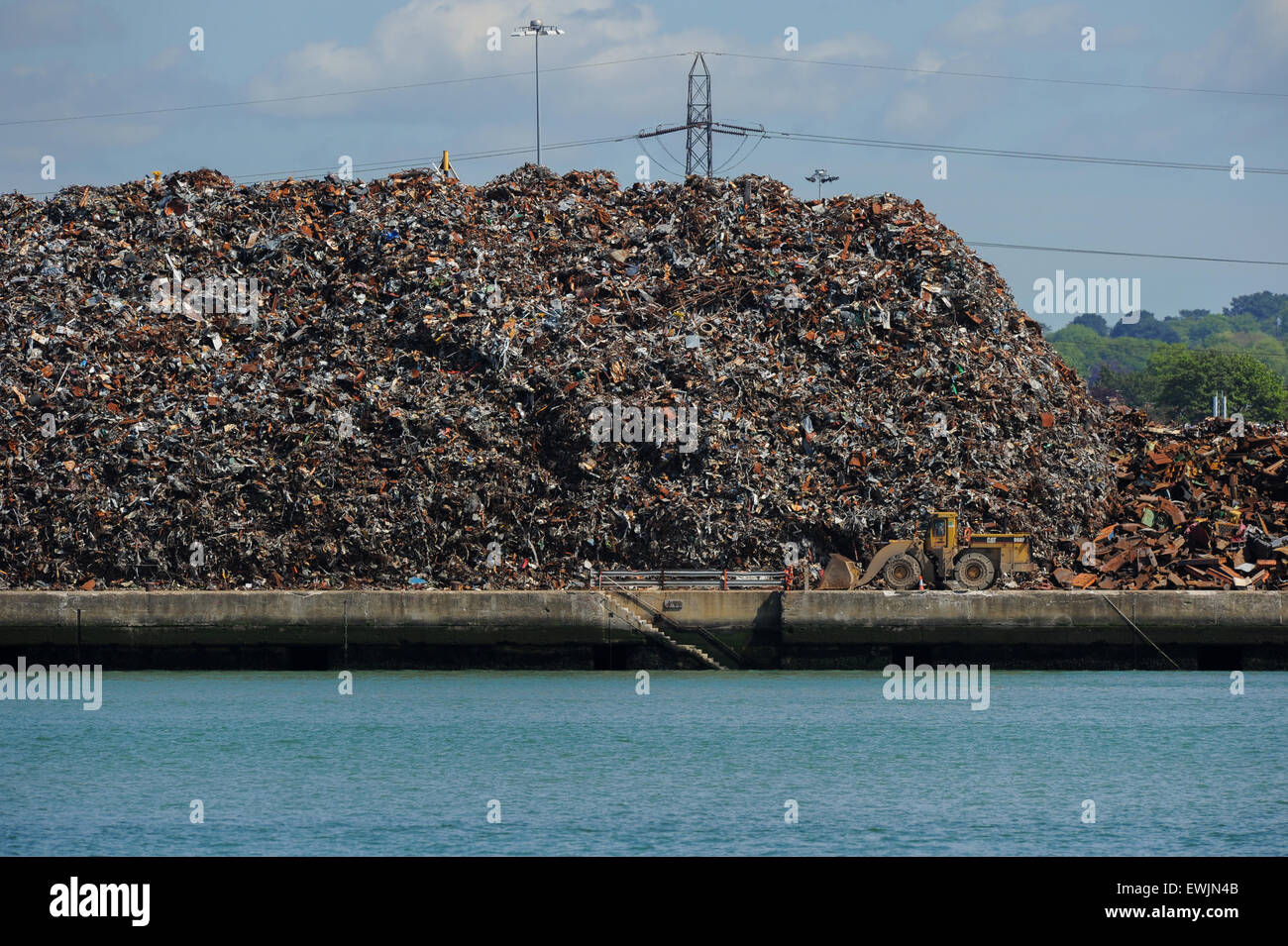 Scrap metal and recyclables stacked up ready for transportation on ships from Southampton docks Stock Photo