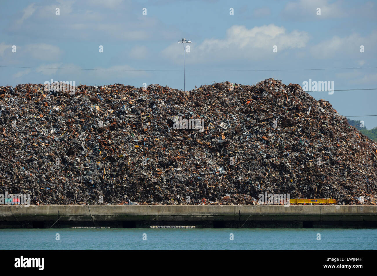 Scrap metal and recyclables stacked up ready for transportation on ships from Southampton docks Stock Photo