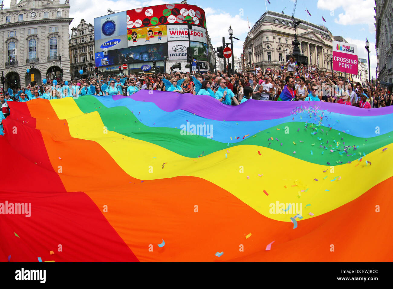 London, UK. 27th June 2015. Participants with a giant Rainbow Flag at the London Pride Parade 2015 Credit:  Paul Brown/Alamy Live News Stock Photo