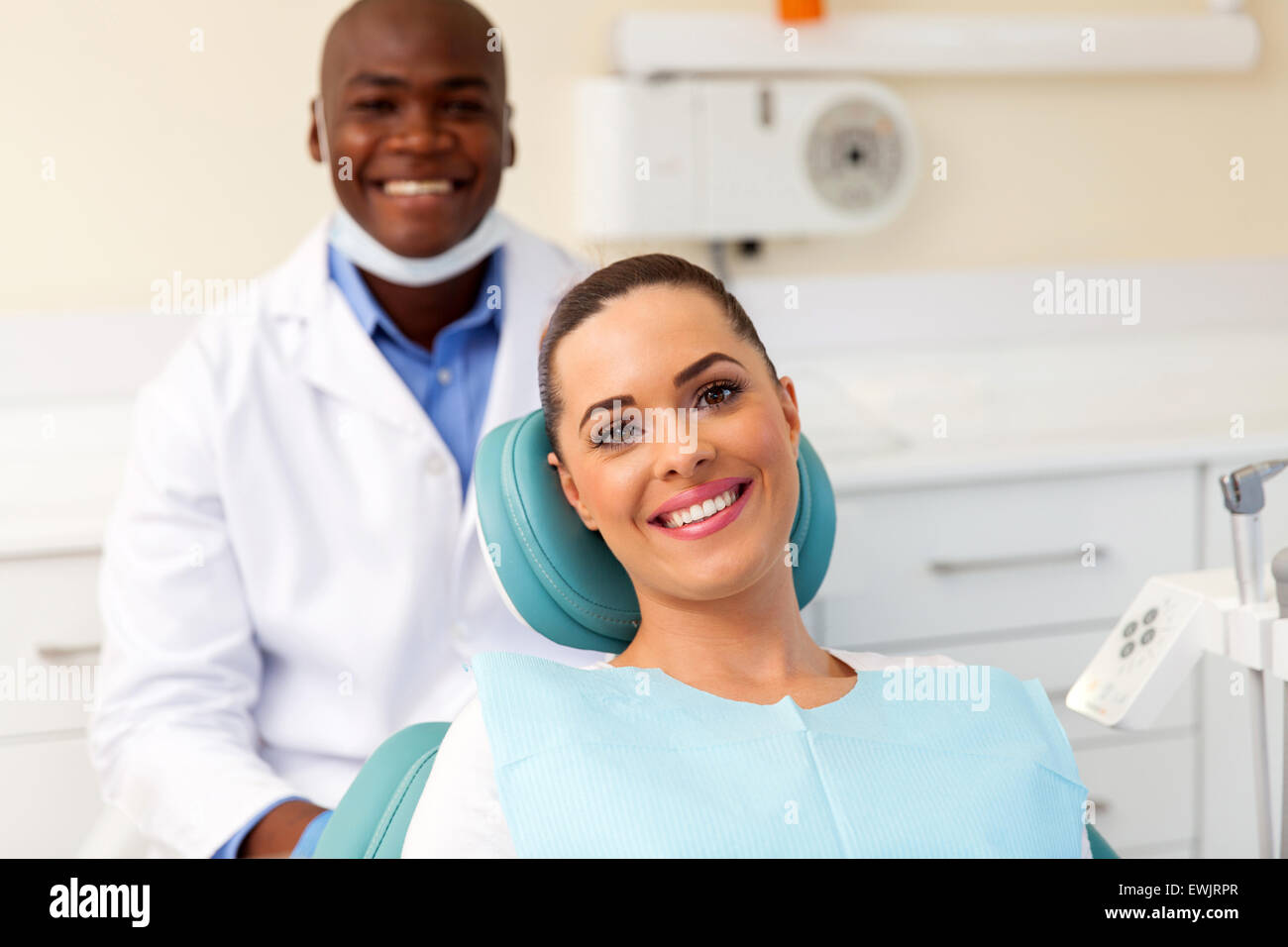 happy young patient in dentist office Stock Photo