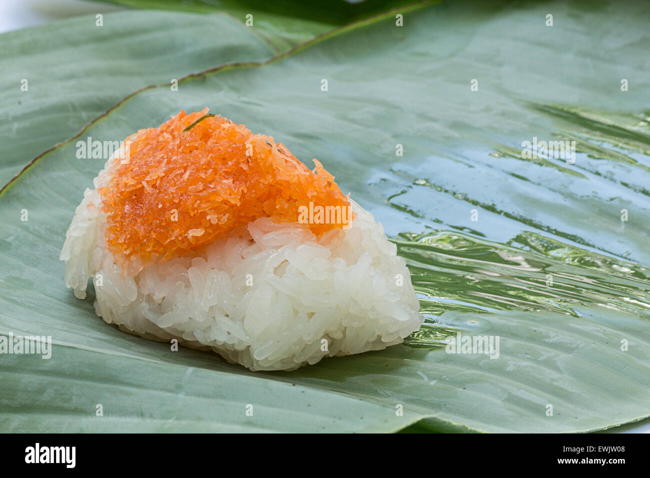 Sticky rice with Shrimp and shred coconut , wrapped in banana Stock Photo