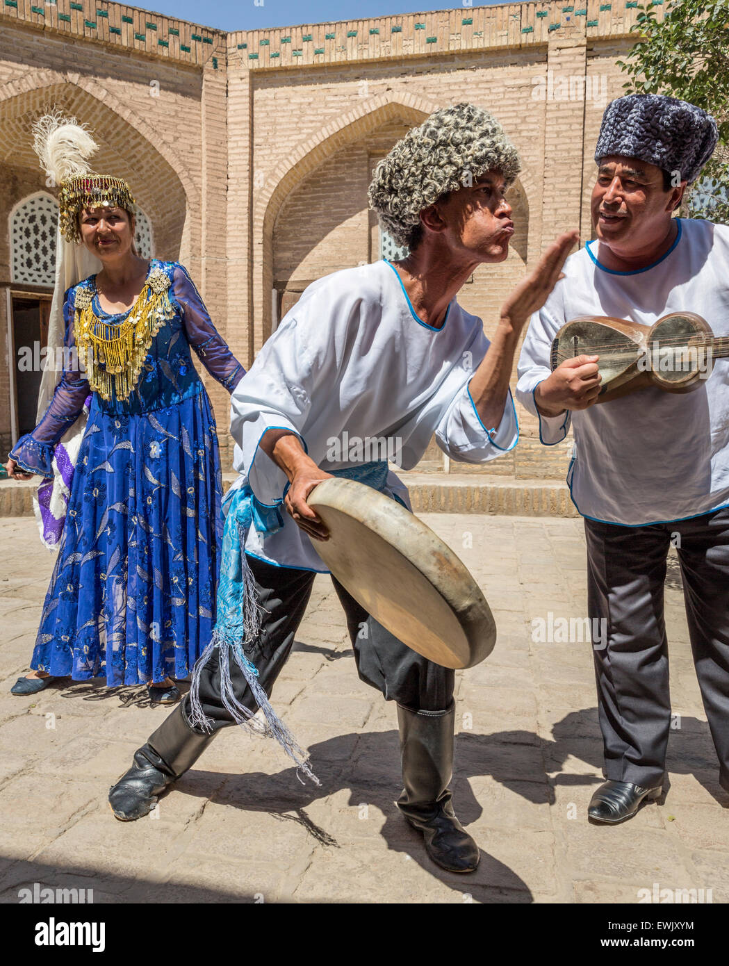 Traditional Khorezm dancer and musicians performing at the Music Museum, Khiva Uzbekistan Stock Photo