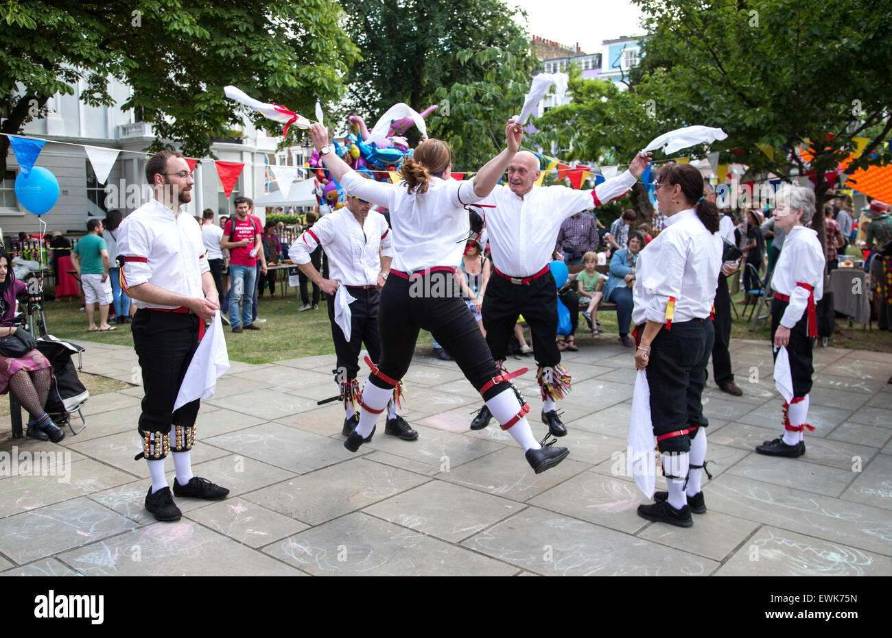 Morris dancers performing and dancing at a festival Stock Photo