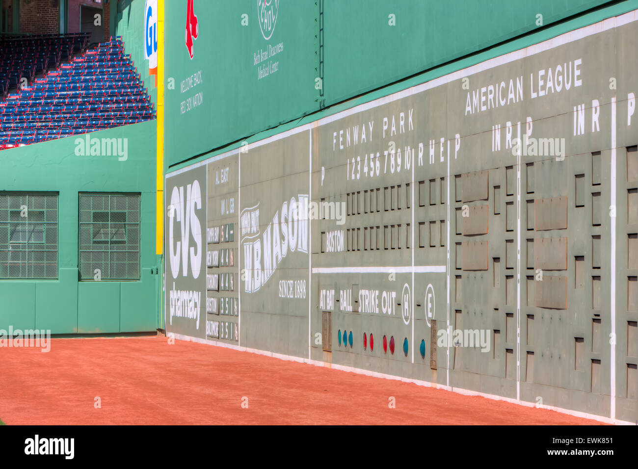 The Green Monster, the famed left field wall, towers over the field in iconic Fenway Park in Boston, Massachusetts. Stock Photo