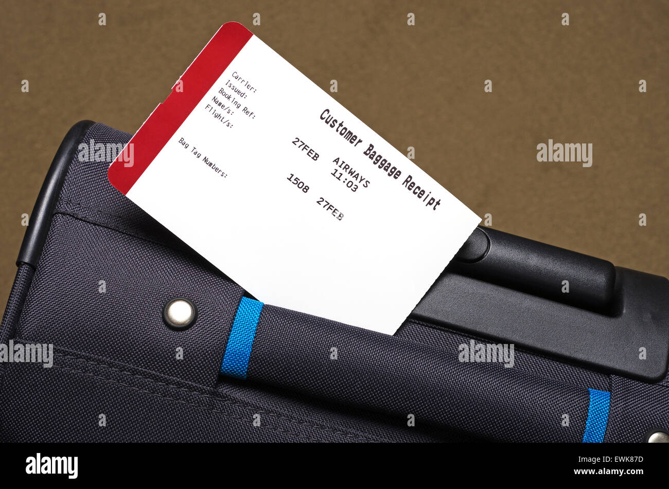 luggage receipt label and a holiday suitcase Stock Photo