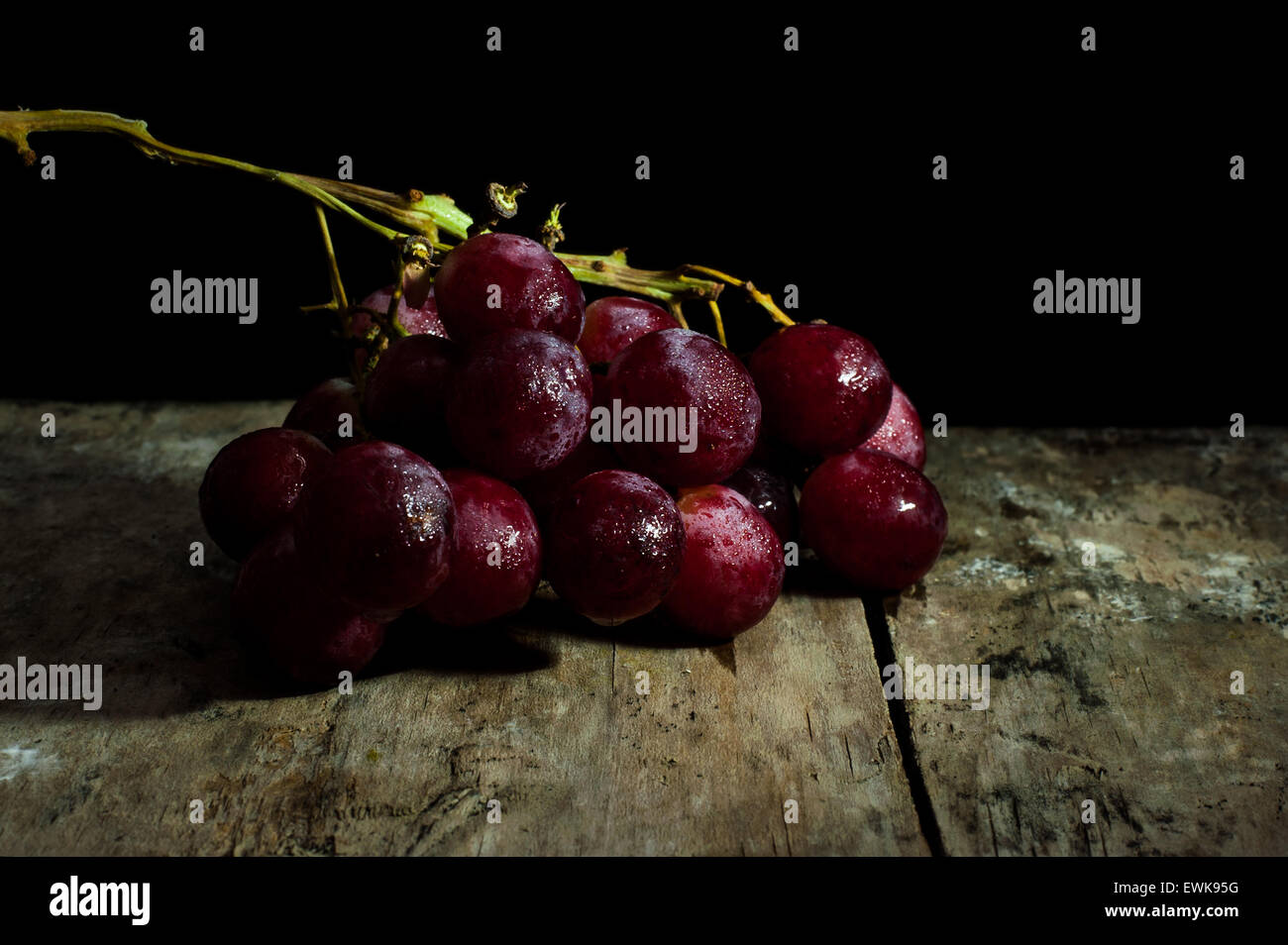 Wine grapes light painting, Abstract fruit still life concept for wine tasting or harvest vineyard on black background Stock Photo