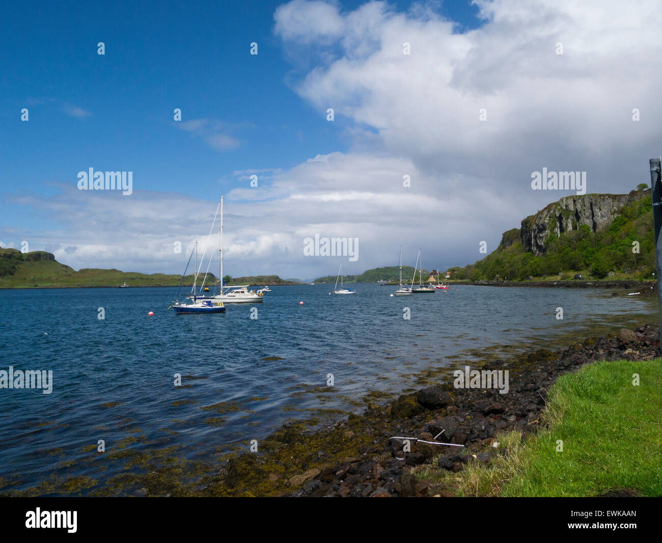 Yachts moored in calm Sound of Kerrera popular tourist resort town Oban Argyll and Bute Scotland on lovely May day weather blue sky Stock Photo