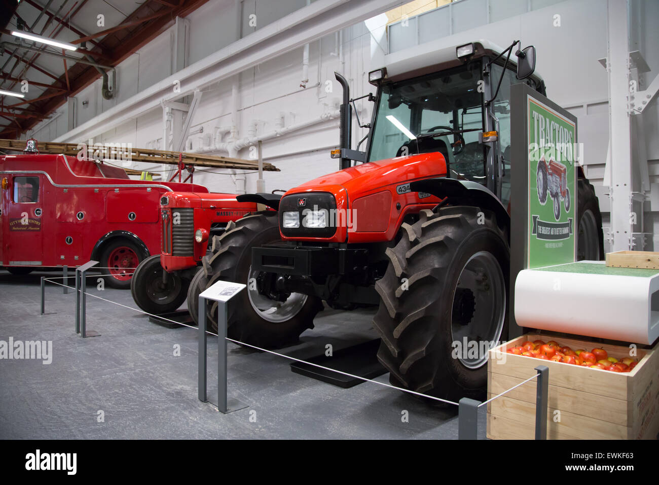 2002 Massey Ferguson tractor on display at Coventry Transport Museum alongside a vintage tractor Stock Photo