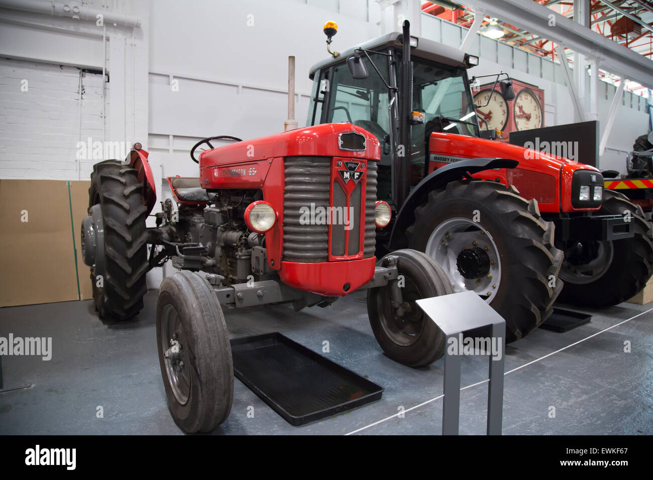 2002 Massey Ferguson tractor on display at Coventry Transport Museum alongside a vintage tractor Stock Photo