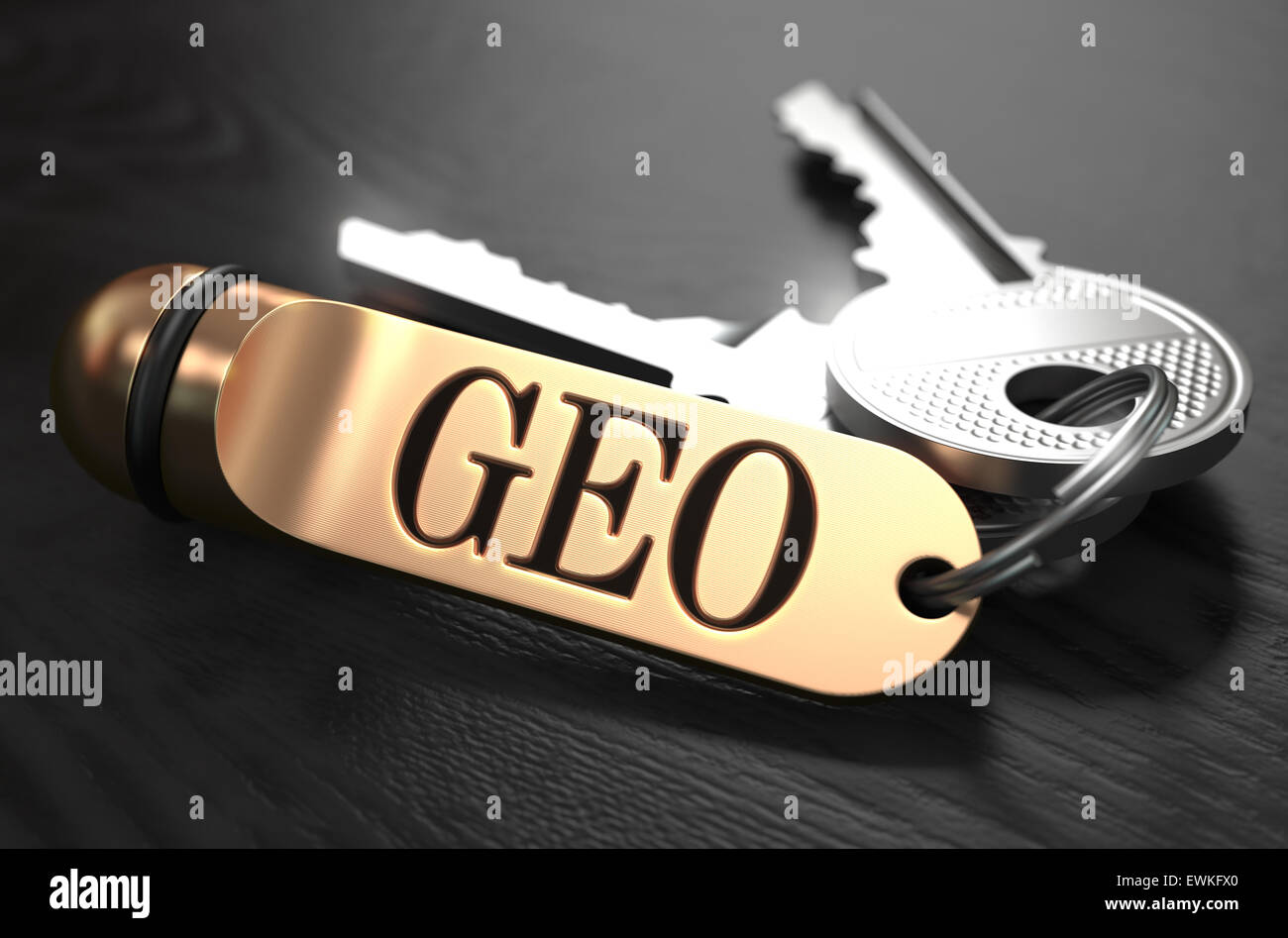 GEO written on Golden Keyring. Stock Photo