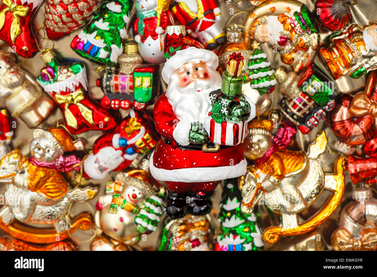 Santa Claus with christmas tree decorations baubles, toys and colorful ornaments. Selective focus Stock Photo