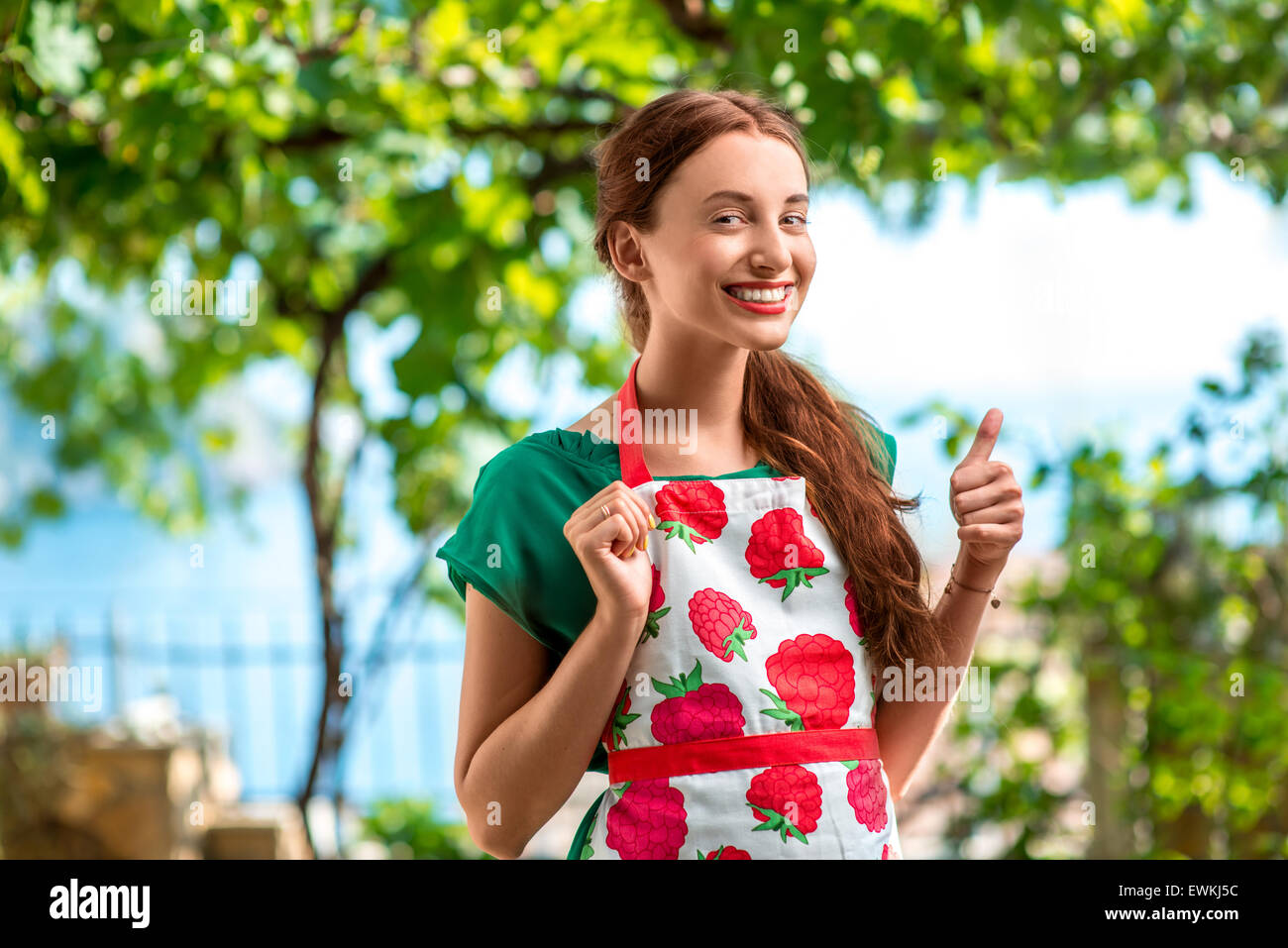 Portrait of a young woman gardener Stock Photo - Alamy