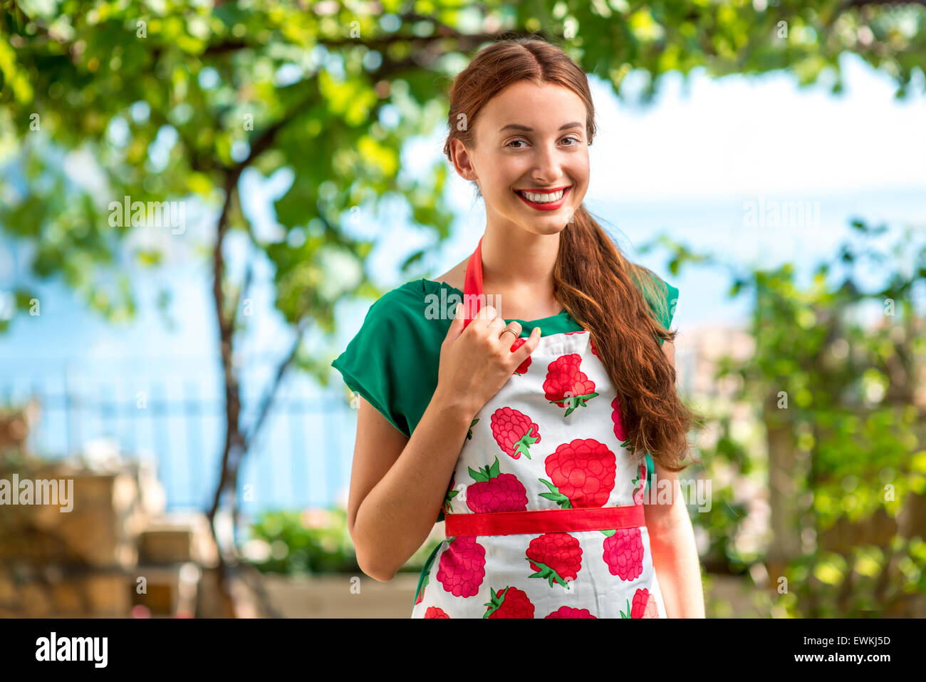Portrait of a young woman gardener Stock Photo - Alamy