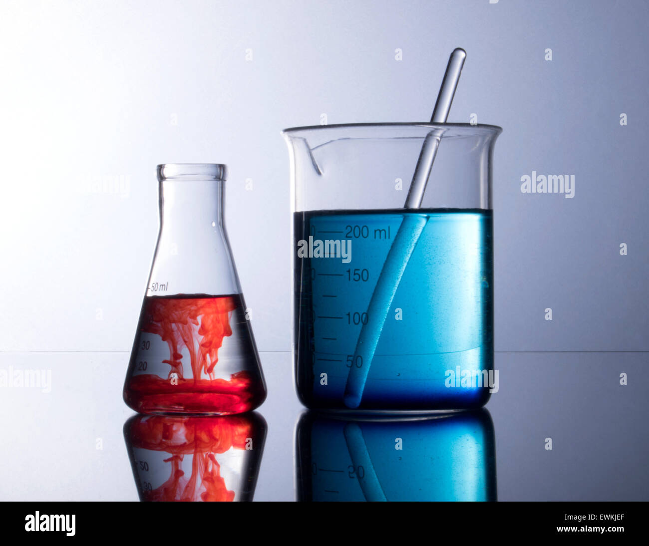 beakers with red and blue chemicals Stock Photo Alamy