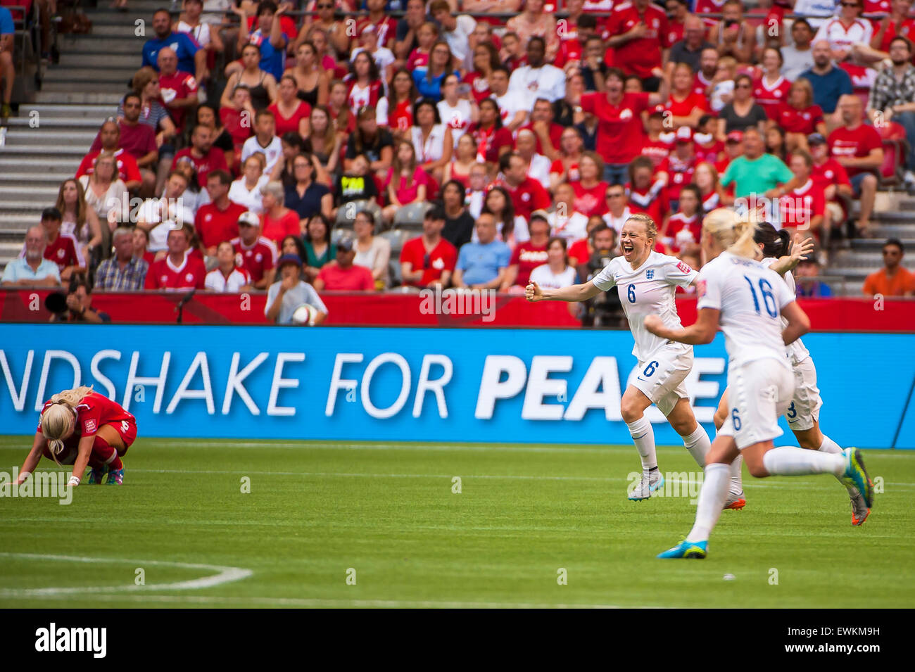Vancouver, Canada. 27th June, 2015. England players celebrate and Canadian players react following the quarterfinal match between Canada and England at the FIFA Women's World Cup Canada 2015 at BC Place Stadium. England won the match 2-1. Credit:  Matt Jacques/Alamy Live News Stock Photo