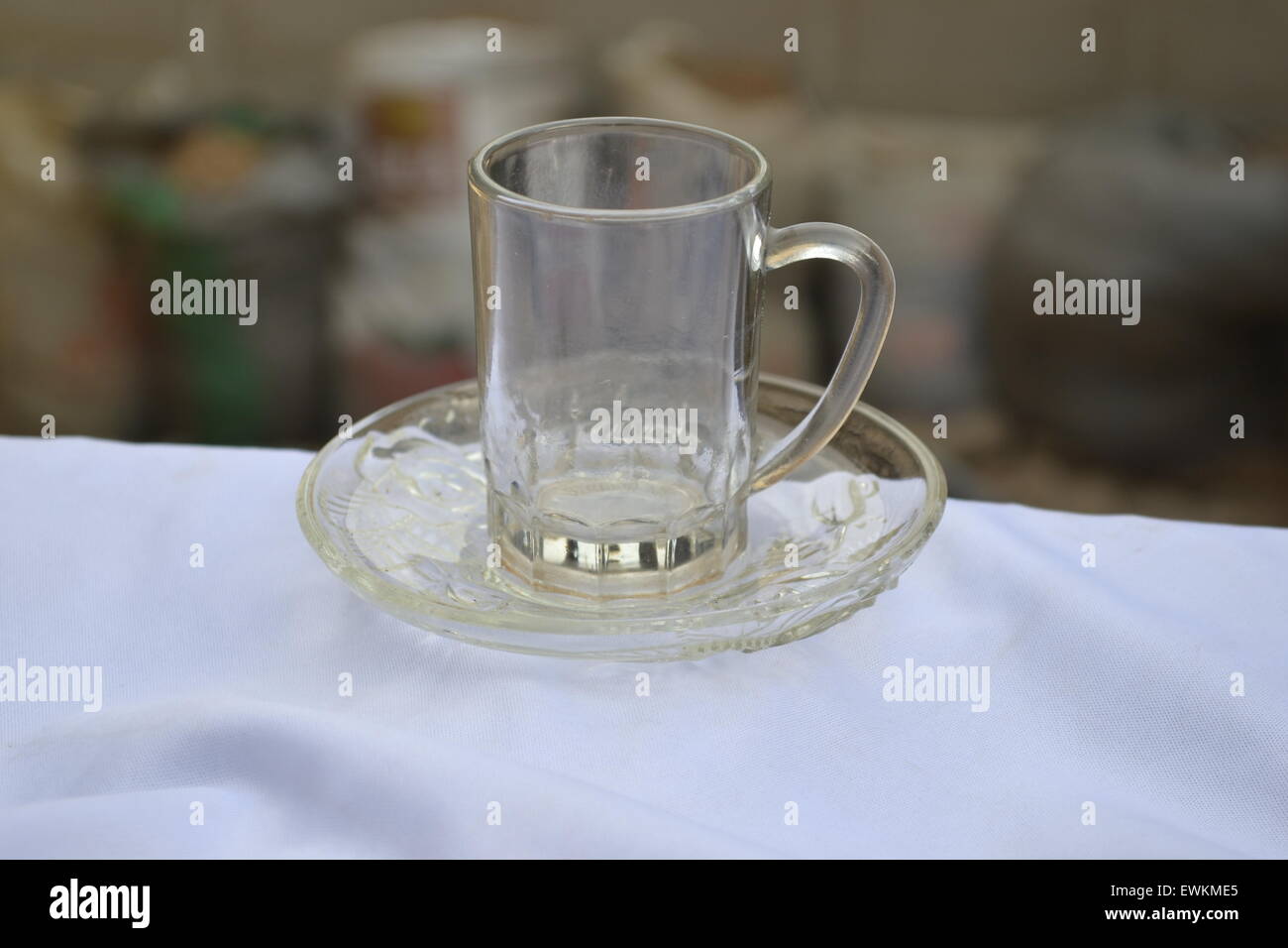 https://c8.alamy.com/comp/EWKME5/a-beverage-small-glass-cup-on-saucer-EWKME5.jpg
