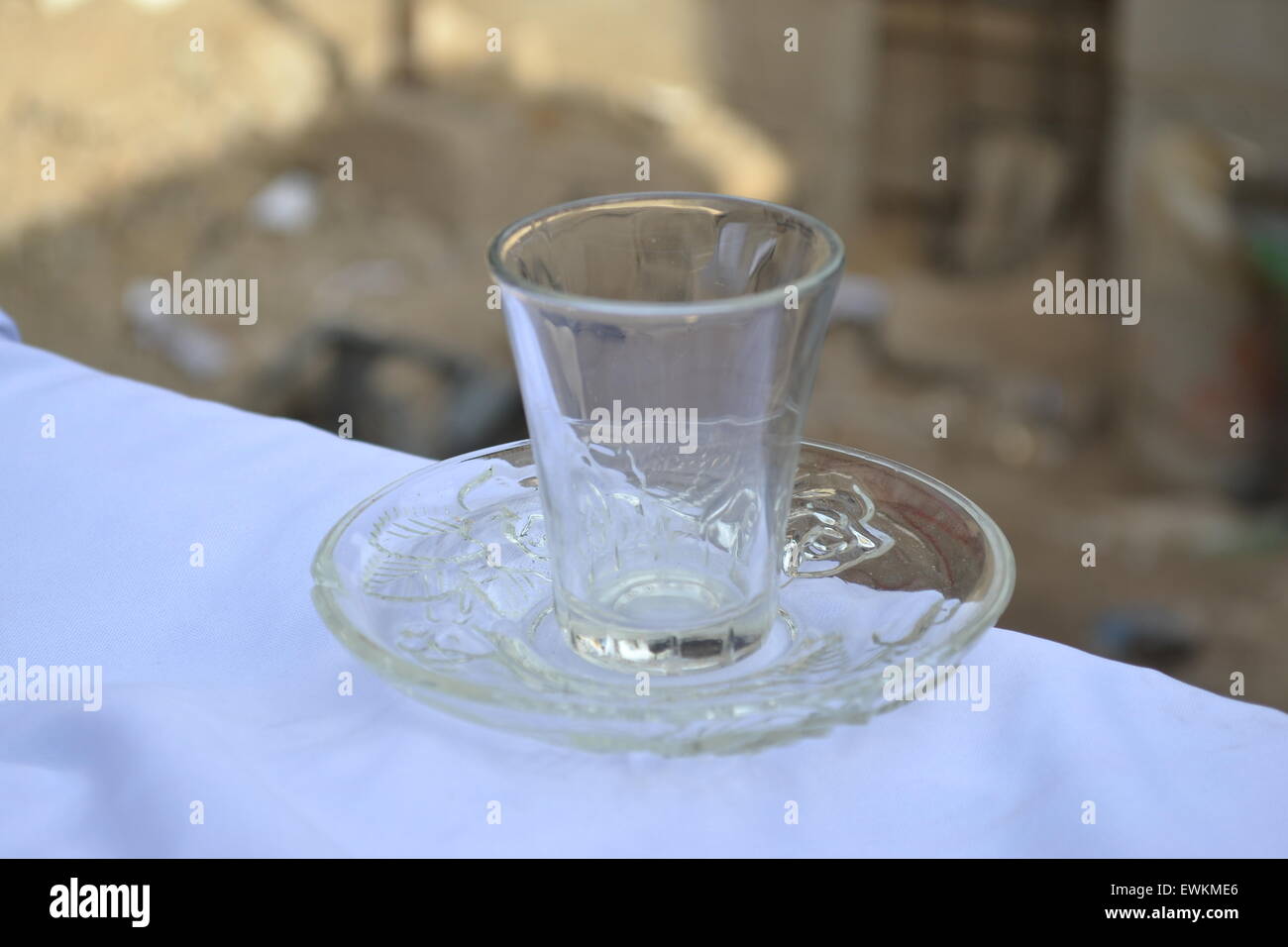 https://c8.alamy.com/comp/EWKME6/a-beverage-small-glass-cup-on-saucer-EWKME6.jpg