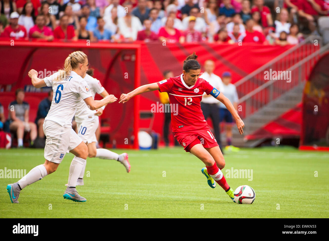 Vancouver, Canada. 27th June, 2015. Canada forward Christine Sinclair (#12) with the ball during the quarterfinal match between Canada and England at the FIFA Women's World Cup Canada 2015 at BC Place Stadium. England won the match 2-1. Credit:  Matt Jacques/Alamy Live News Stock Photo