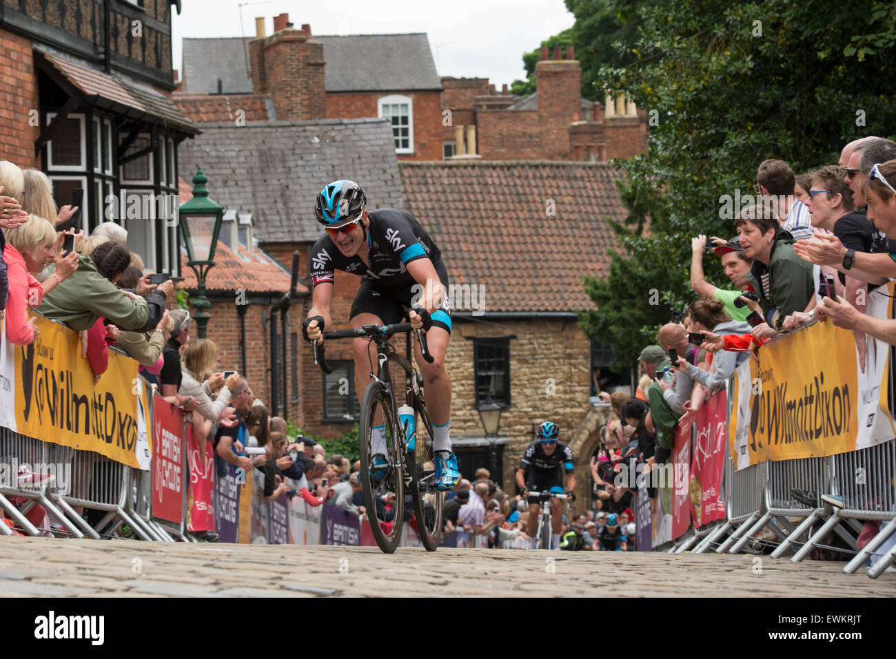 Lincoln, UK. 28th June, 2015. Ian Stannard (Team Sky) leads the race up the cobbled climb of Wordsworth Street during the British Cycling Road Race Championships at Lincoln, United Kingdom on 28 June 2015. Stannard finished third in the race, won by Sky teammate Peter Kennaugh. Credit:  Andrew Peat/Alamy Live News Stock Photo