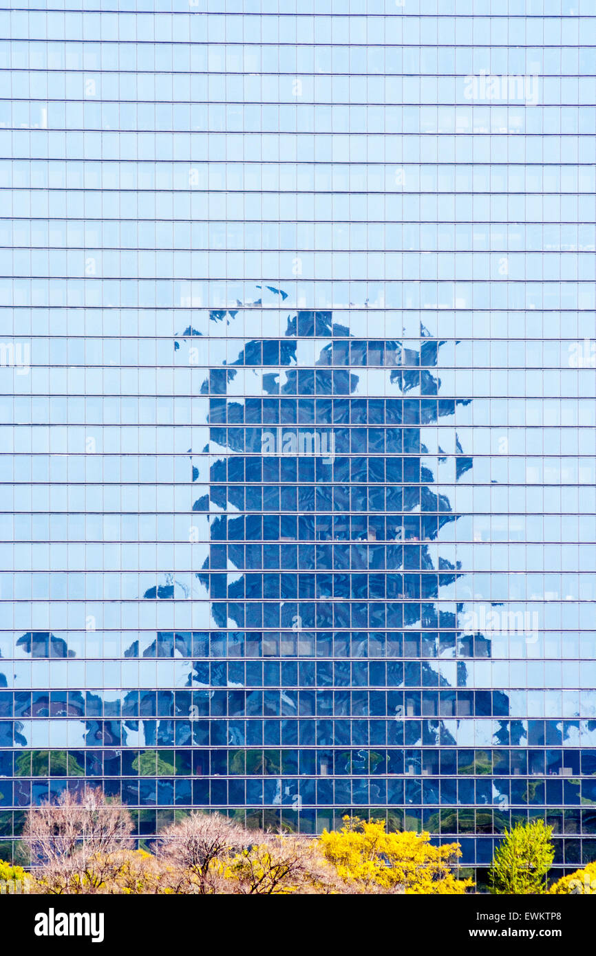 All reflective glass office block in Osaka near the castle with abstract reflection of another