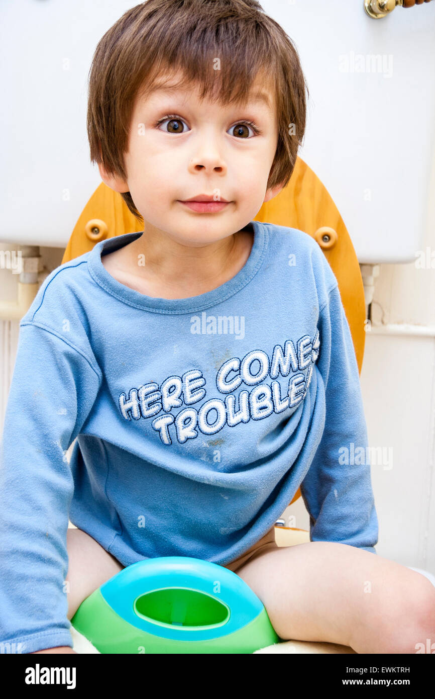 3 to 5 year old Caucasian boy sitting on toilet seat, front view Stock Photo 84644437 Alamy