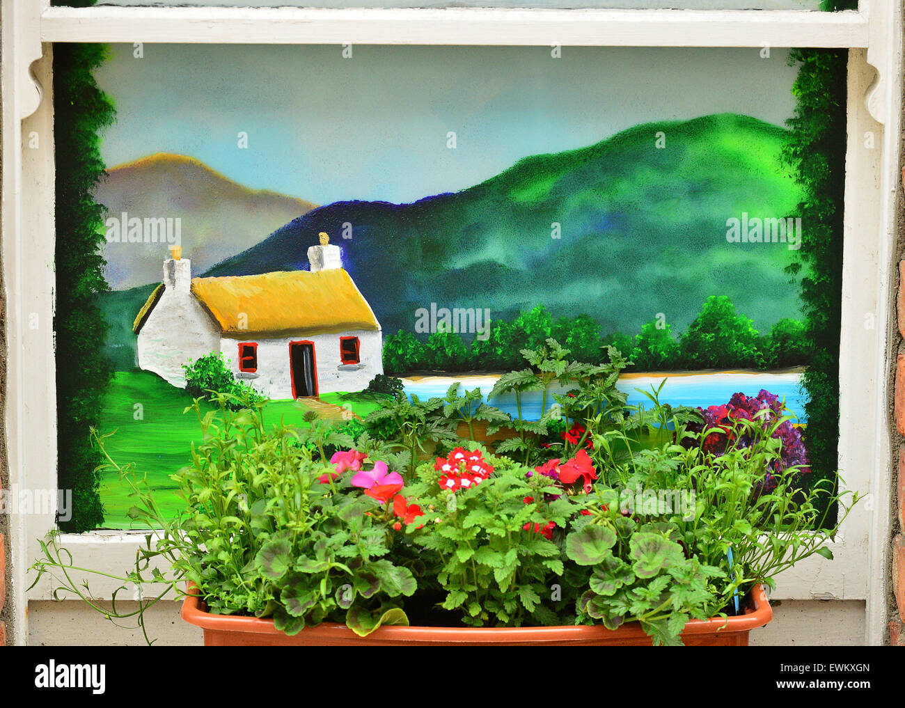Window flower box and painted window depicting an Irish cottage in the