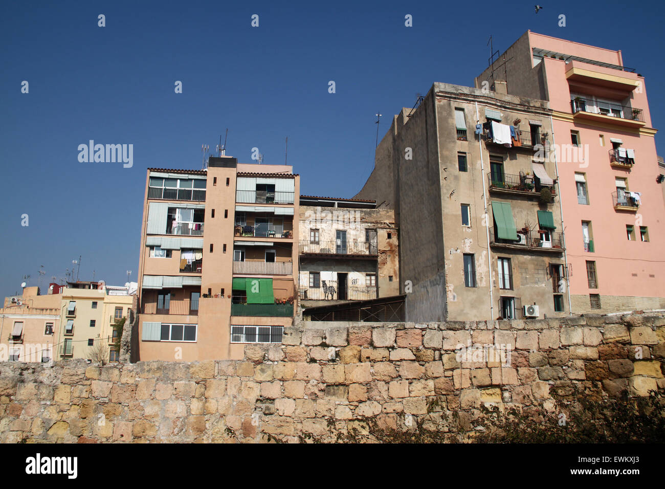 Apartment blocks behind old city wall in Tarragona, Catalonia, Spain Stock Photo