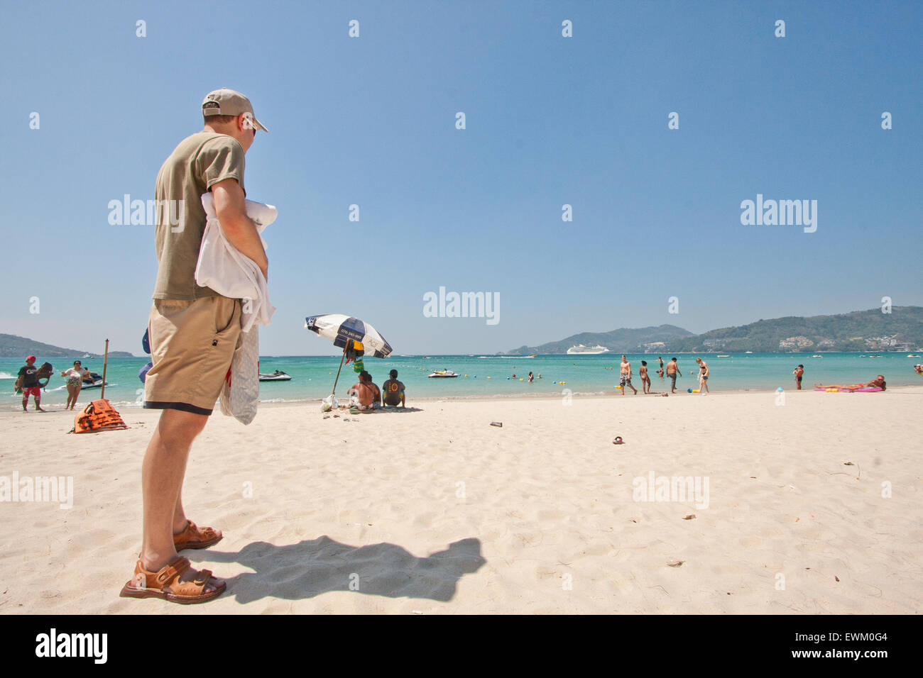 turist on a beach in Thailand, Phuket, Patong, sandals Stock Photo