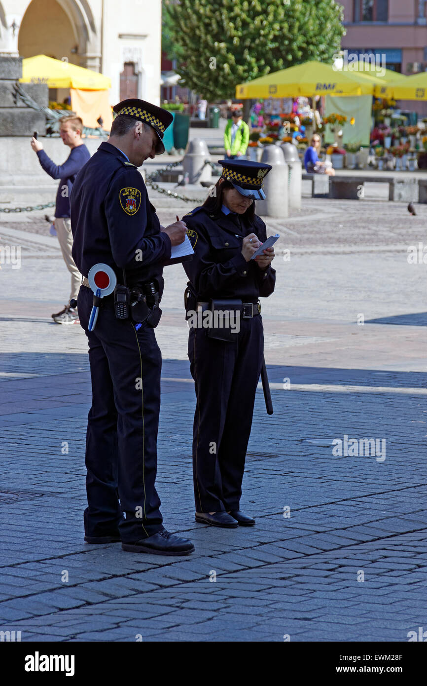Two Traffic Wardens, Krakow, Poland Stock Photo