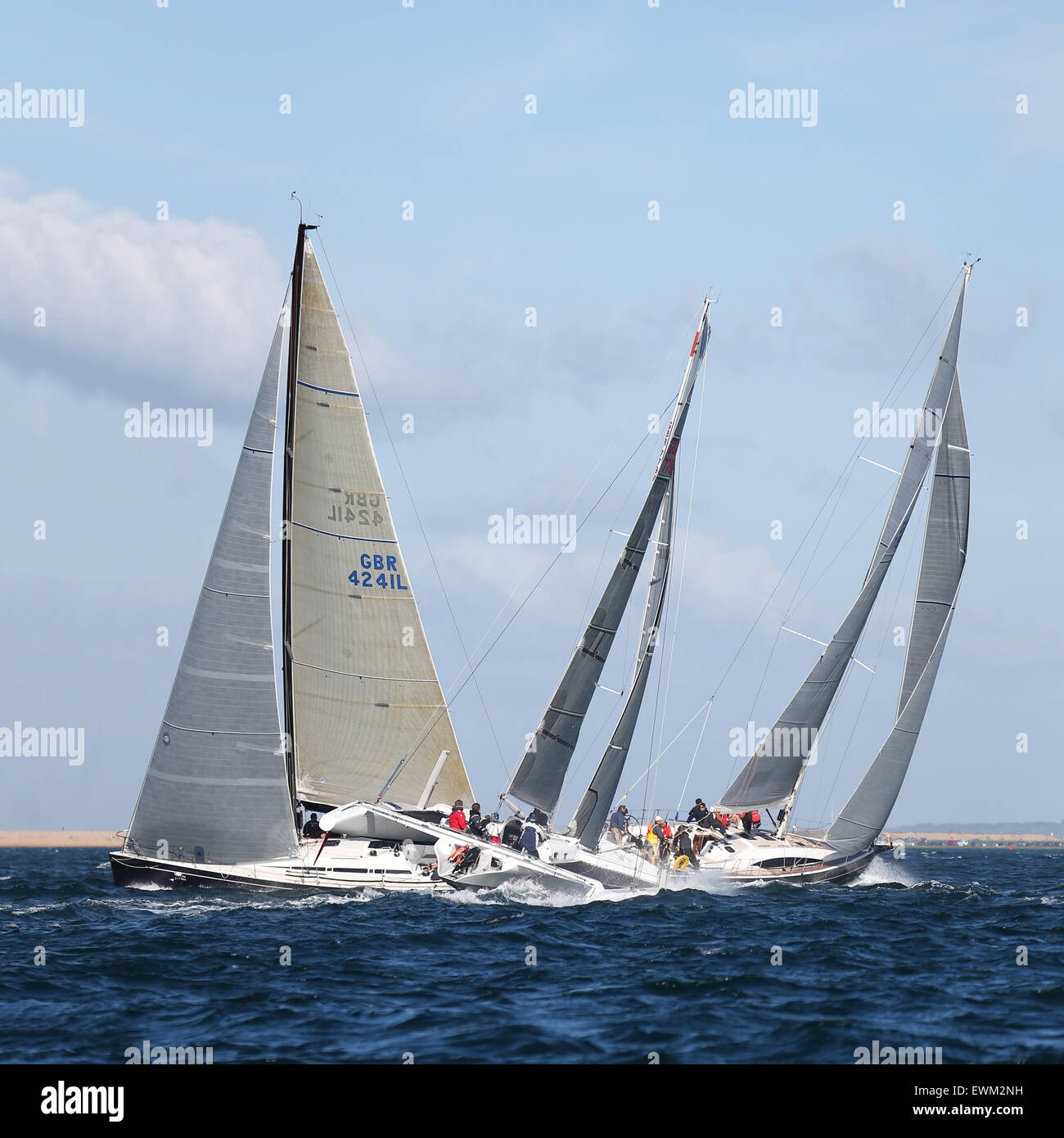 UK. 27th June, 2015. A close encounter between a multihull and two other yachts during the 2015 Round the Island Race Credit:  Niall Ferguson/Alamy Live News Stock Photo