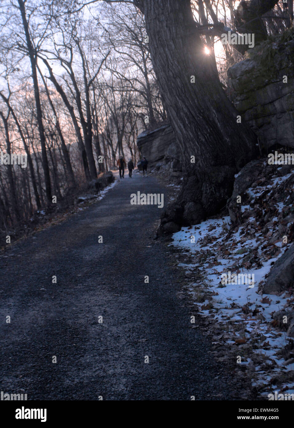 Hikers on a trail on the Shawangunk Ridge at sunset, New York state. Stock Photo