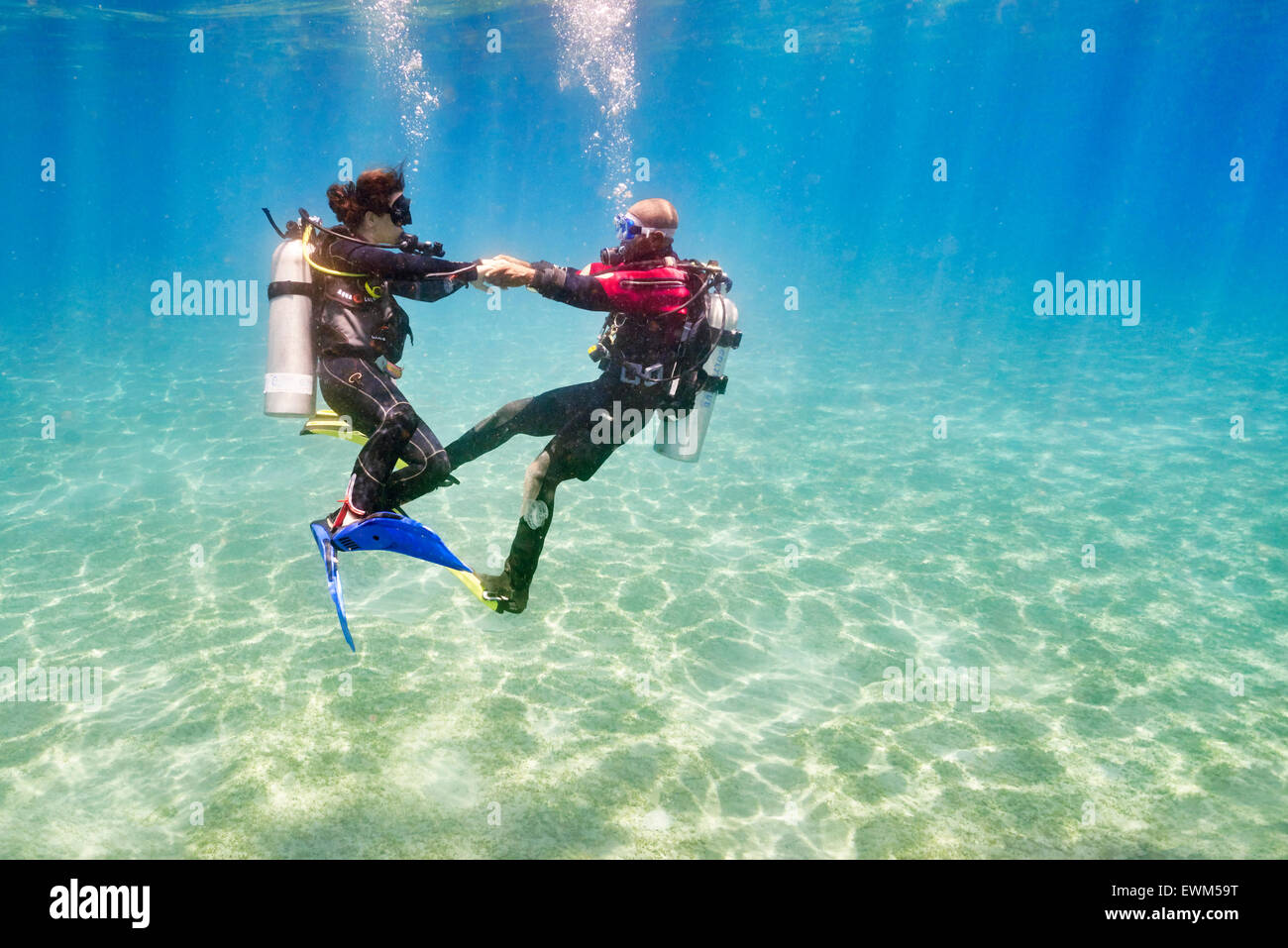 Dive instructor with novice diver, first underwater dive, Marsa Alam, Red Sea, Egypt Stock Photo