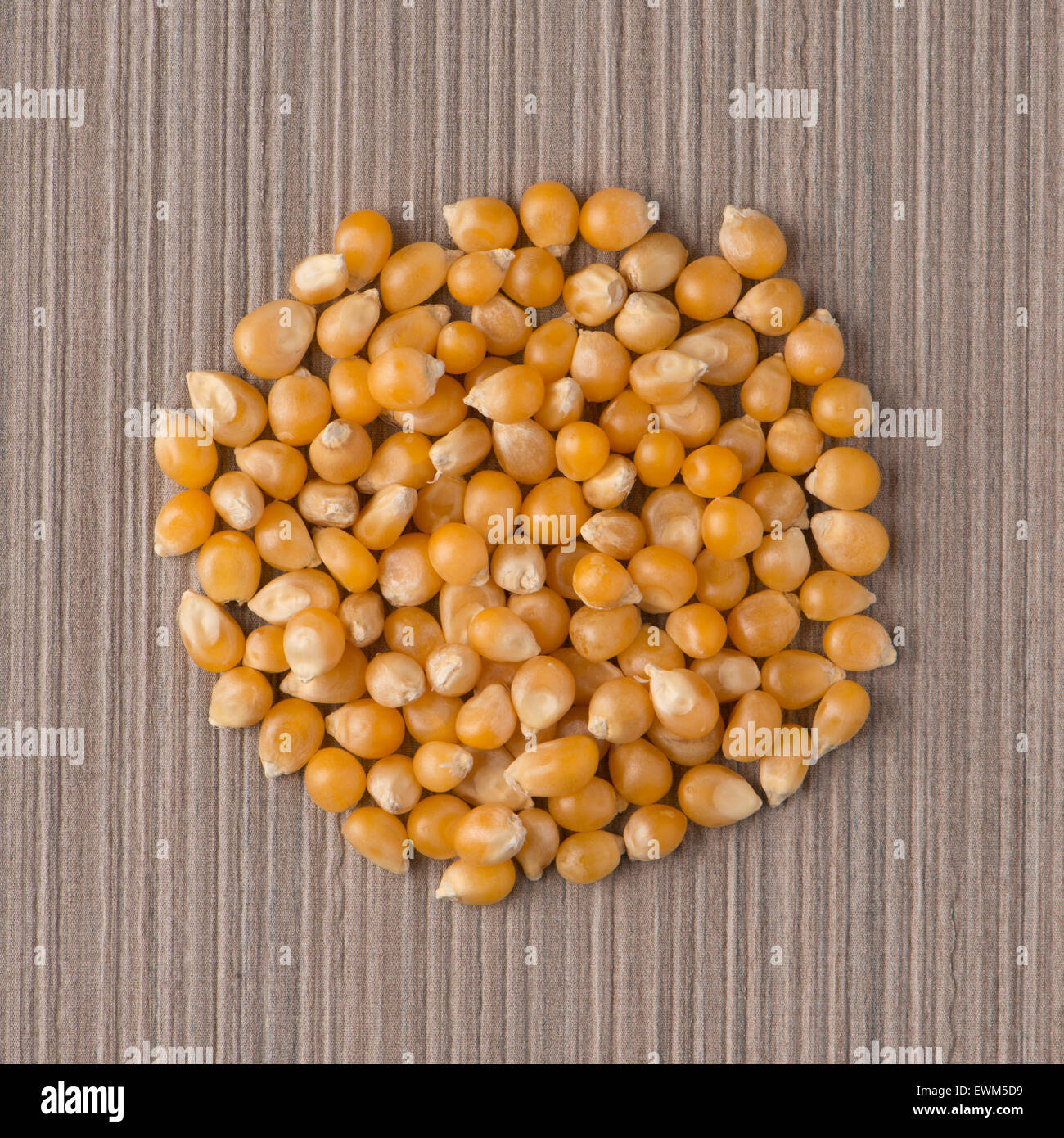 Top view of circle of corn against beige vinyl background Stock Photo ...