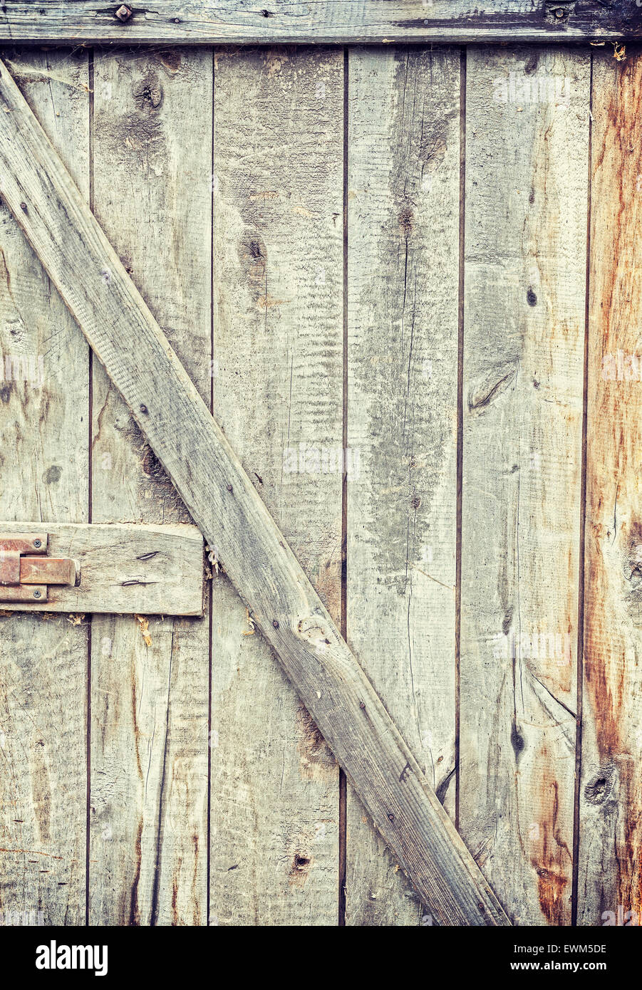 Old grungy wooden barn door, background or texture. Stock Photo